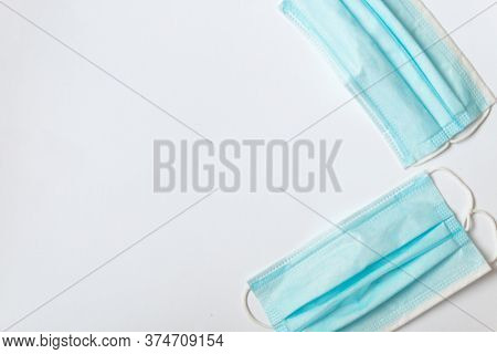 Two Blue Masks On A White Table