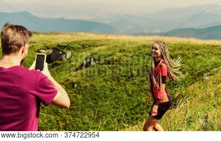 Young Adventurers. Couple Taking Photo. Couple In Love Hiking Mountains. Lets Take Photo. Capturing 