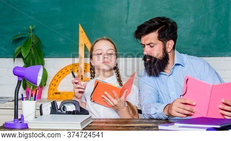 School Teacher And Schoolgirl. Help Study. Discipline Upbringing. Lesson Is Finished. Man Bearded Pe