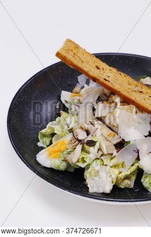 Caesar Salad Romain Lettuce, Boiled Egg, Anchovy And Bread Cruton