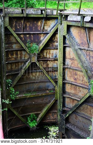 Old Rusty Floodgate\n Gates Abandoned Anthropogenic Landscape