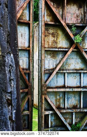 Old Rusty Floodgate\n Gates Abandoned Anthropogenic Landscape
