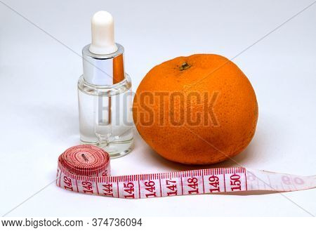 Medicine Bottle With Fluid, Orange Fruit And Tailors Centimeter. Weight Control Or Slimming Diet Con