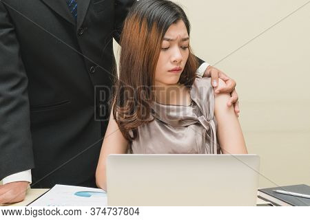 Sexsual Harassment In Workplace. Unhappy Female Employee Looking At Hand Of Boss Touch At Her Should