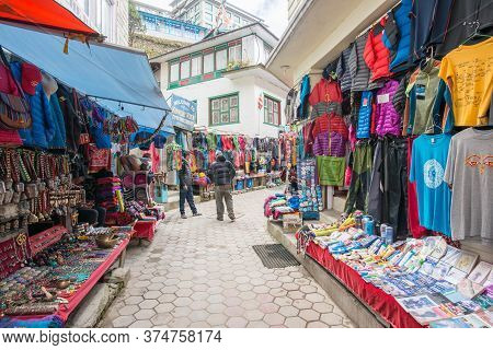 Namche Bazaar, Nepal : October-14-2018 :  The Clothing And Souvenir Shops In The Main Street Of Namc