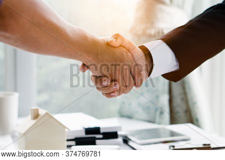 Concept Signing Business Contract, Close Up Above View Of Businessman And Client Shaking Hands After