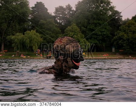 Free Diving Or Apnea Diving With Mask On The Surface Of A Lake