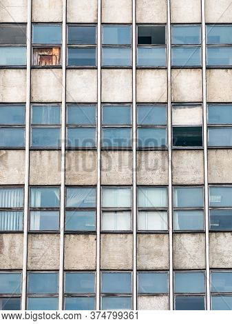 Detail With Very Old Office Building From Communist Era. Worn Out Office Building.