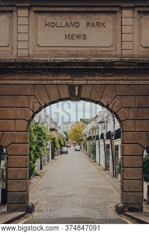 London, Uk - June 20, 2020: Named Stone Arch Entrance To Holland Park Mews. Houses In Mews Are One O