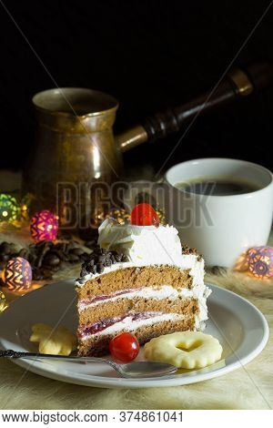Portion Of Vanilla And Cream Cake Served On A Plate With Cookies And Coffee