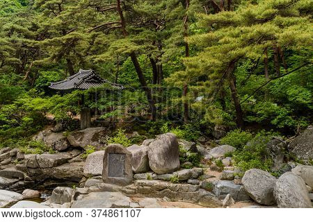 Haeinsa-gil, South Korea; May 26, 2020: Large Boulders Inscribed With Chinese Characters With Tiled 