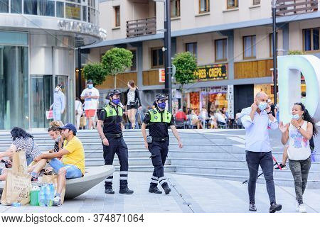 Andorra La Vella, Andorra : 2020 July 06 : People Walk In The Comercial Street Named Meritxell After