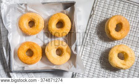 Homemade Deep Fried Donuts In Stack With Sugar Paper Marble Table.top View