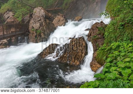 Bridge Over The River From The Gollinger Waterfall. Austria