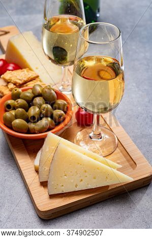 Glasses Of Dry Cold Fino Sherry Wine Served With Spanish Tapas, Manchego Cheese, Green Olives, Chees