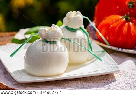 Fresh Italian White Soft Cheese Burrata Or Burratina Served On Outdoor Terrace In Sunny Day