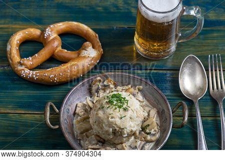 Bavarian Bread Dumpling With Sauce On Green