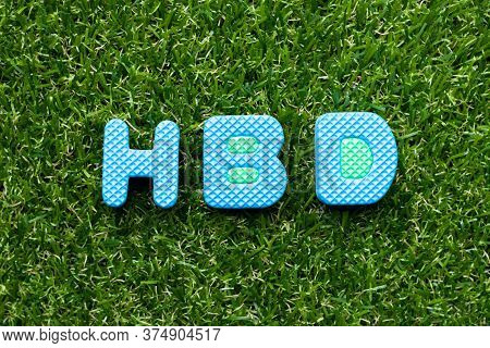 Toy Foam Letter In Word Hbd (abbreviation Of Happy Birthday)  On Green Grass Background