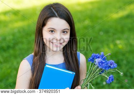 Happy Childrens Day. Happy Girl Got Flowers For Childrens Day. Little Child On Summer Outdoor. Child