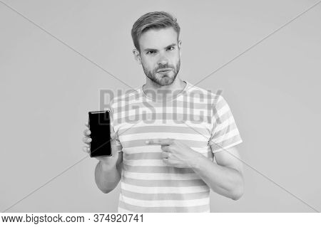 Download And Start Play. Man Pointing At Smartphone. Pointing Gesture. Index Finger Pointing. Pointi