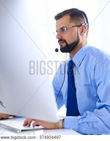 Businessman In The Office On The Phone With Headset, Skype, Facetime