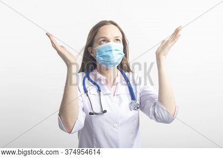 Young Caucasian Doctor Woman In Mask Over Isolated Background Begging And Praying With Hands With Ho