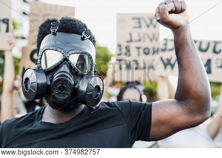 Activist Wearing Gas Mask Protesting Against Racism And Fighting For Equality - Black Lives Matter D
