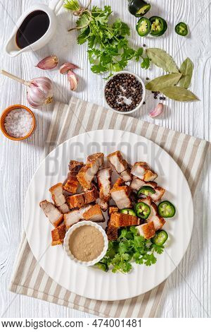 Lechon Kawali, Filipino Crispy Fried Pork Belly With Liver Sauce And Fresh Coriander On White Plate 