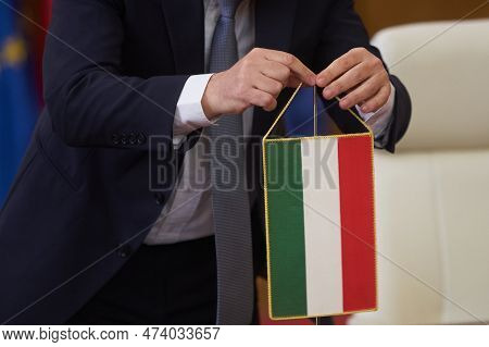 Bucharest, Romania. 4th Apr, 2023: A Member Of The Hungarian Delegation Places The Hungarian Flag Be