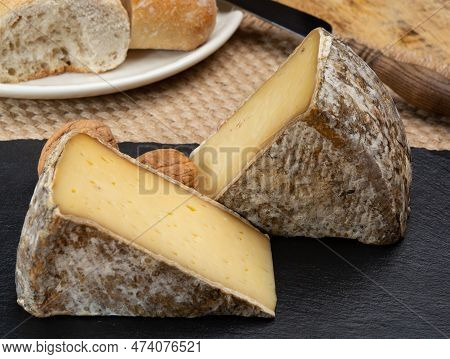 Pieces Of Cheese Tomme De Montagne Or Tomme De Savoie Made From Cow Milk In French Alps Close Up