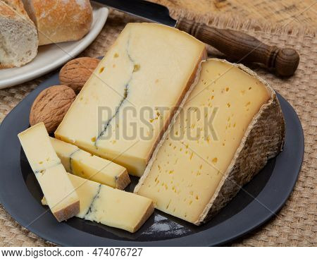 Cheese Collection, French Cheeses Morbier Semi-soft Cow Milk Cheese With Black Mold Layer And Tomme 