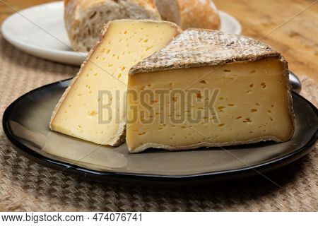 Pieces Of Cheese Tomme De Montagne Or Tomme De Savoie Made From Cow Milk In French Alps Close Up