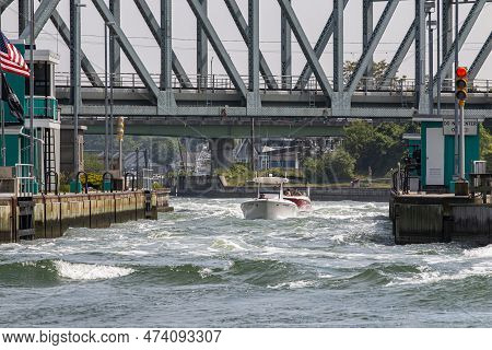 Hampton Bays, New York, Usa - 20 June 2020: Two Motor Boats Trying To Navigate The Open Rough Water 