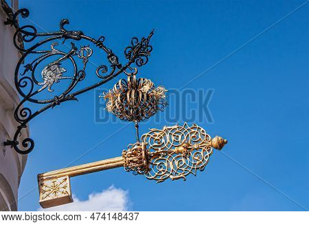 Copenhagen, Denmark - September 13, 2010: Wrought Large Golden Key Above Corner Of Sankt Peders And 