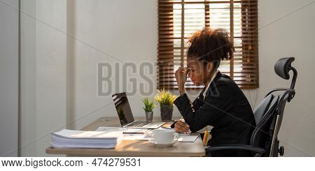 Stress, Anxiety And Burnout With A Business Black Woman At Work Using A Laptop While Suffering From 