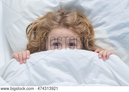 Nightmare Kids, Child Hiding Under White Blanket, Top View. Scared Boy Hiding In Bed. Kid Under Cove