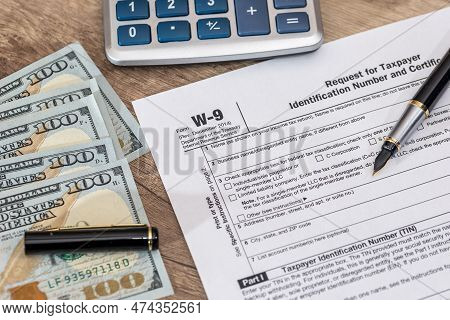 Tax Form - W9 - With Dollar And Pen.