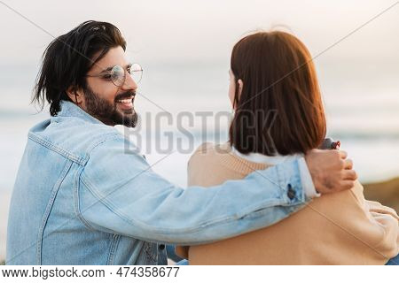 Satisfied Millennial Indian Male Hugging Caucasian Female, Enjoy Spare Time, Romantic Date Near Ocea