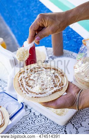 Preparation Of The Wafer With Caramel Sauce, Cheese And Blackberry Sweet - Traditional Colombian Des