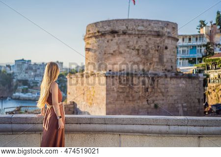 Woman Tourist On Background Of Hidirlik Tower In Antalya Against The Backdrop Of The Mediterranean B