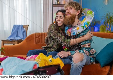 Family Marriage Couple Man Woman Tourists Packing Lot Of Things In Suitcase Luggage, Preparation For