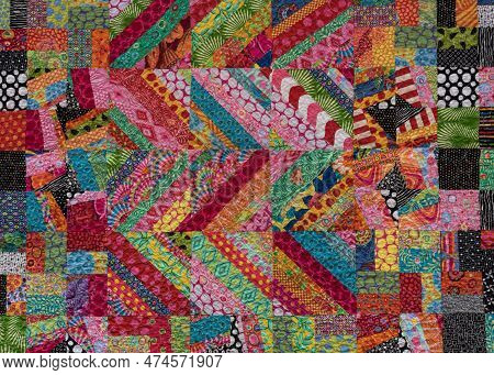 Zig Zag Stripes And Squares  Of Bright Colors On Quilt