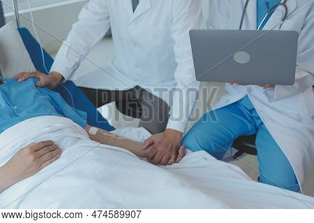 Injured Patient Showing Doctor Broken Wrist And Arm With Bandage In Hospital Office Or Emergency Roo