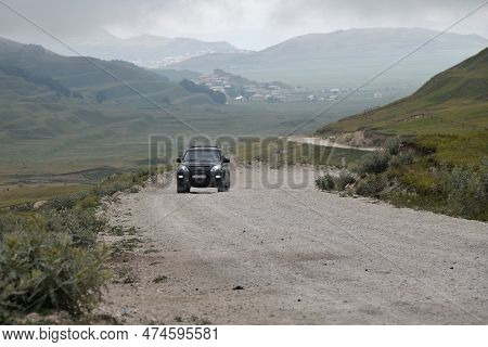Dagestan, Russia - July 23, 2022: Off-road Car Drives On A Dirt Road. Caucasus Mountains. Extreme Mo