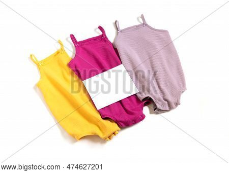 Seconhand, Donate Concept. Used Kids Clothes With Empty Paper Blank. Selling Baby Clothes.