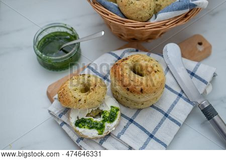 Home Made Whole Grain Bagels With Wild Garic On A Table