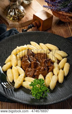 Beef Stew In Gravy, Served With Potato Dumplings.