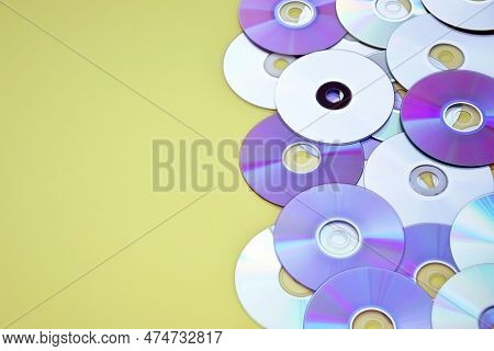 Lots Of Old Cds Are Laid Out As A Background.