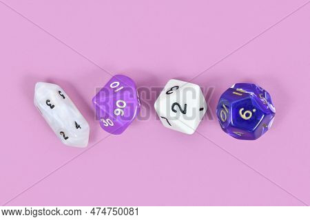 Different Roleplaying Rpg Dice On Violet Background