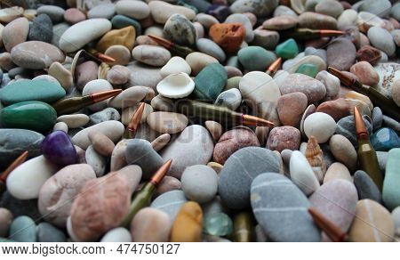 Bullets Are Sprinkled With Small Pebbles And Seashells Angle View Stock Photo